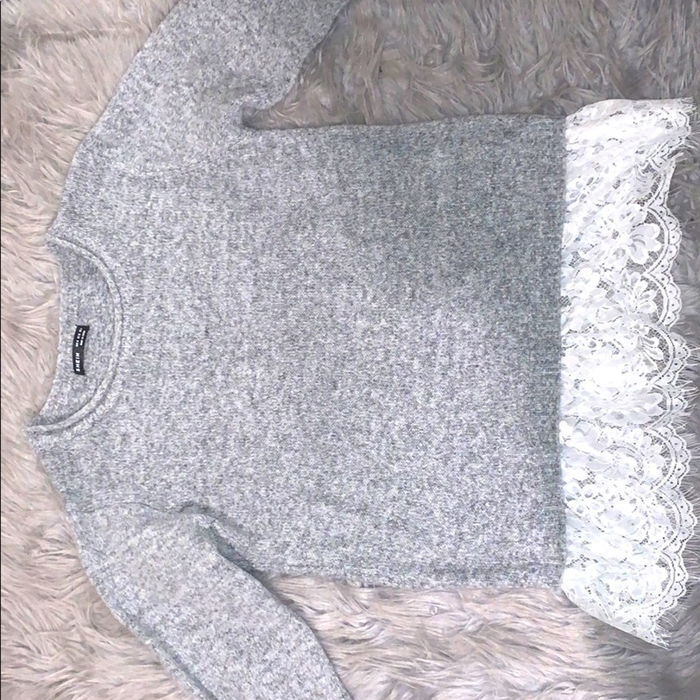 Sweater with lace attached